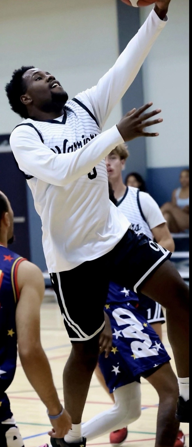 Davohn Caldwell finishing at the basket in his Colorado Warriors uniform