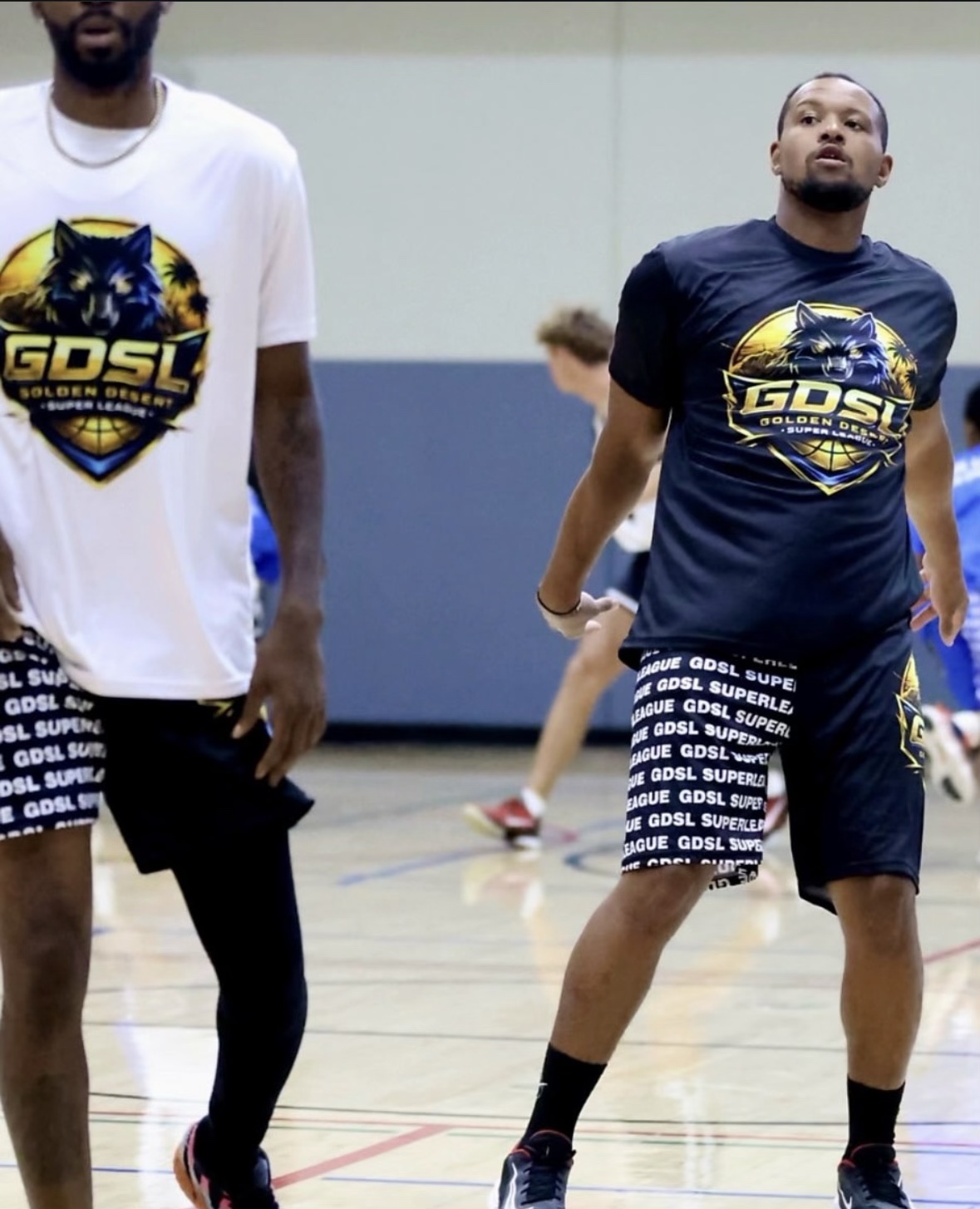 Players wearing Golden Desert Super League basketball apparel