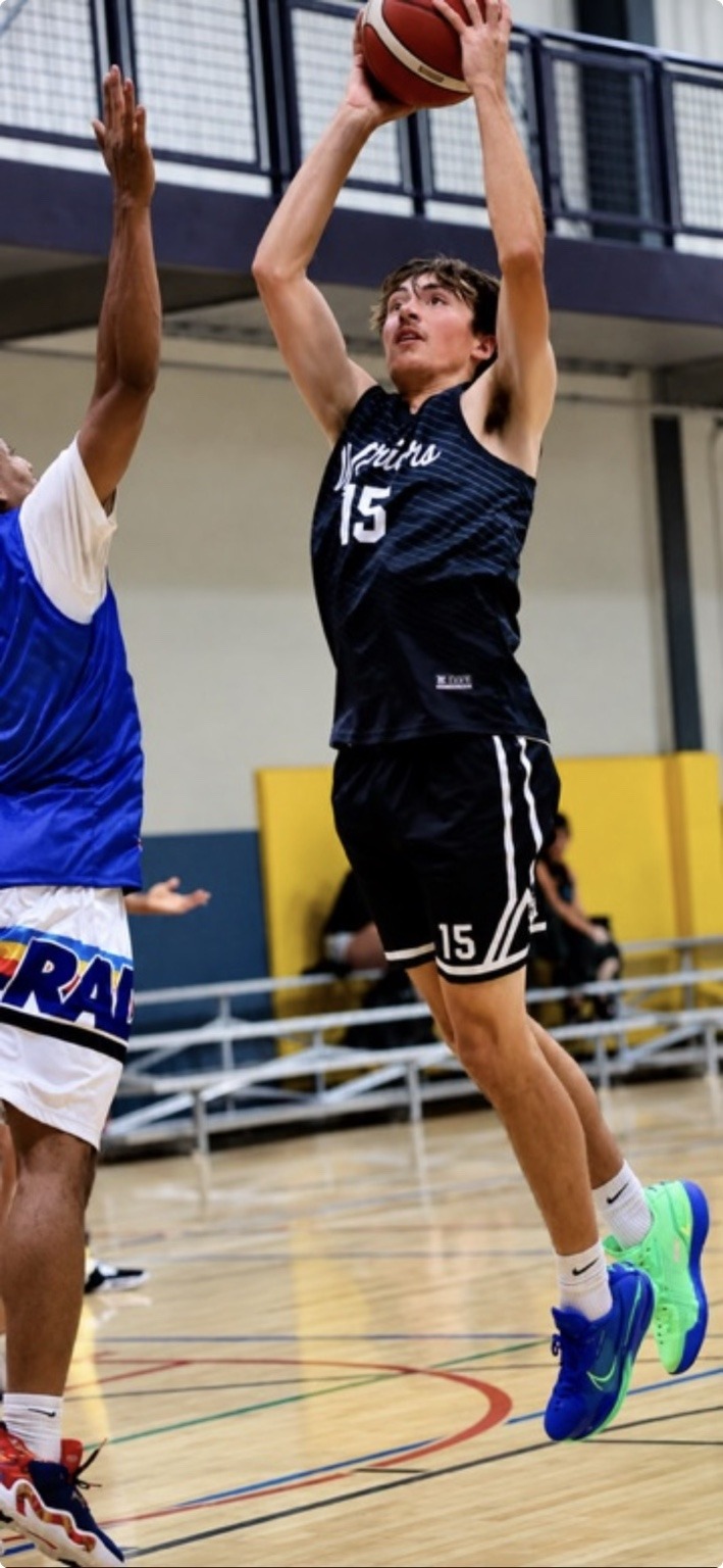 Lawrence Lucero shooting over a defender in his number 15 Colorado Warriors uniform