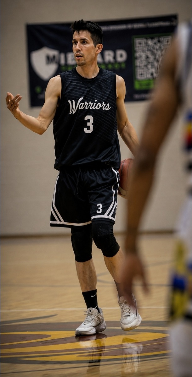 Nick Pedraza wearing his number 3 Colorado Warriors uniform on the basketball court