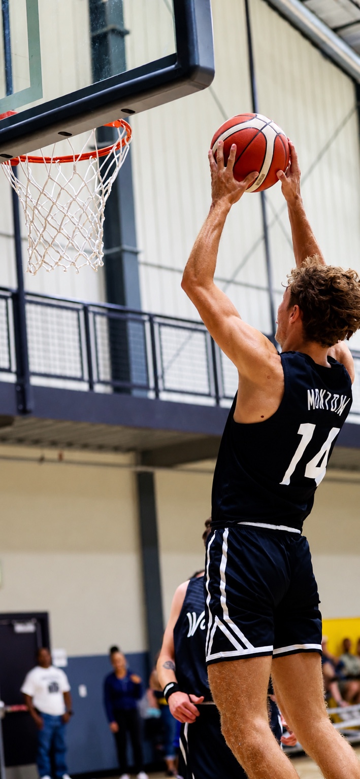 Gabe Montoya rising toward the basket